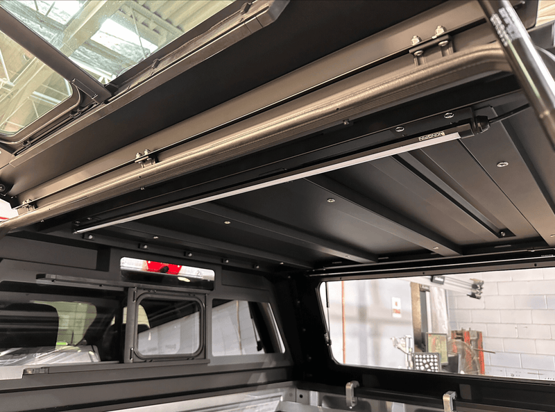 Kingpin v-Series 40" LED lights mounted inside RSI Smartcap truck canopy at Autoplex in Colorado.