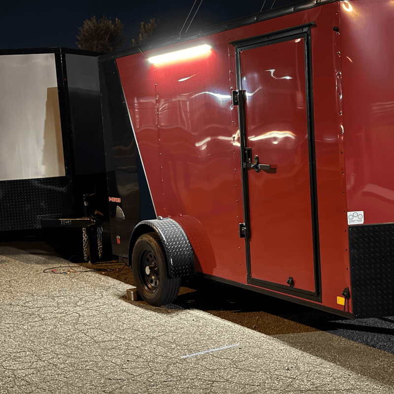 Kingpin v-Series 40" LED light mounted exterior of red enclosed trailer perfect for adventure trailer builds