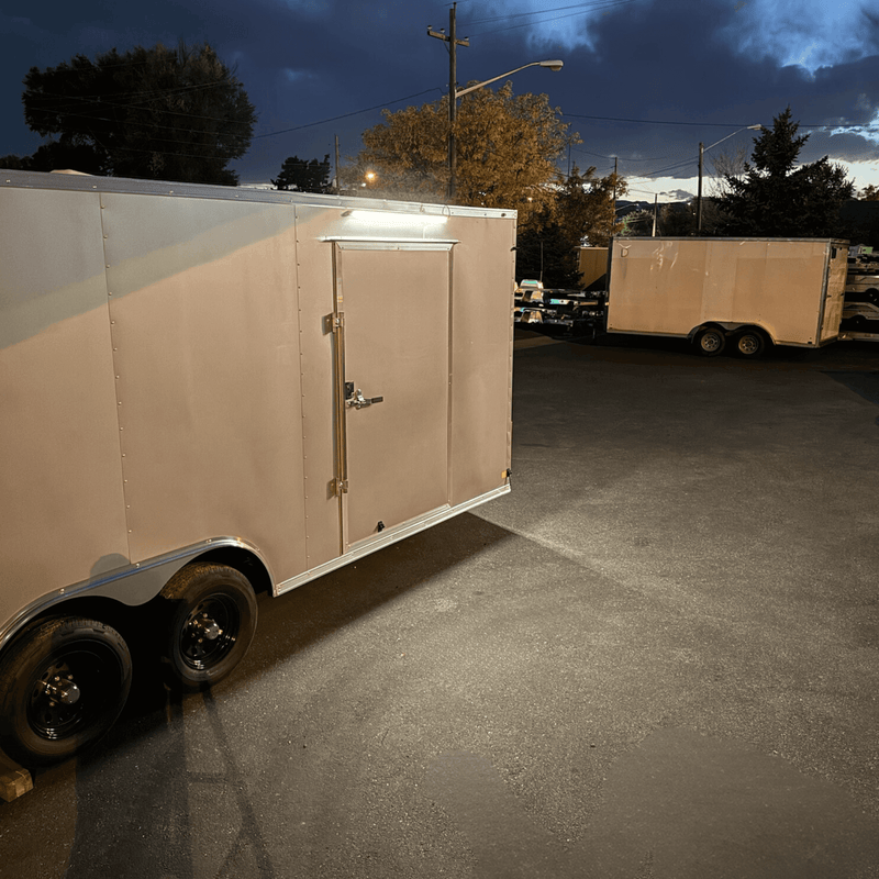 Kingpin v-Series 40" LED light mounted exterior of large, enclosed toy hauler trailer just above the door.