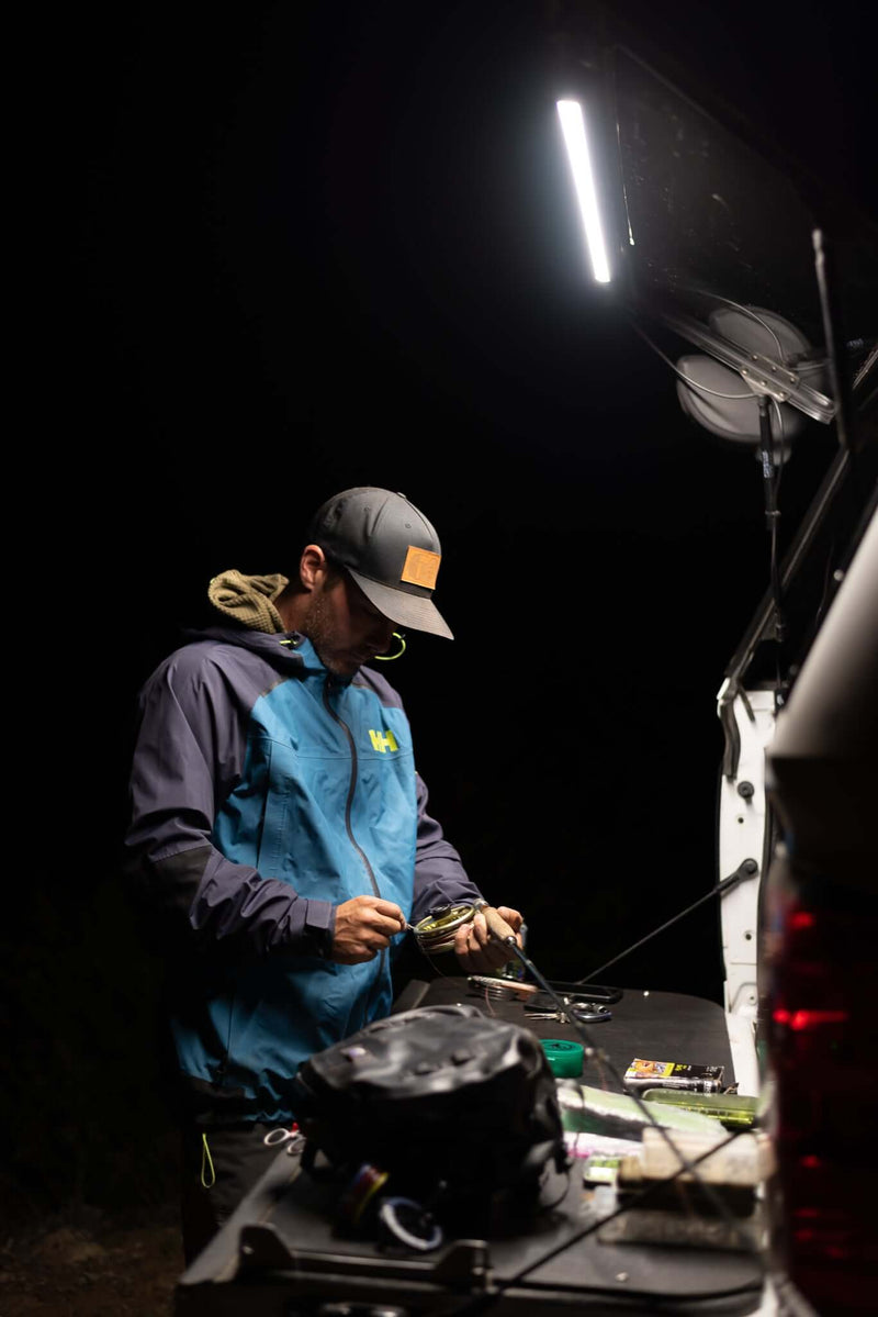 Kingpin v-Series 40" Light bar illuminating tailgate at night for man preparing to night fish